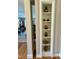 Built-in shelving displays decorative pottery in this home's interior at 817 Old Mill Rd, Chapel Hill, NC 27514