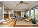 Relaxing sunroom with hardwood floors, comfortable seating, and lots of natural light at 817 Old Mill Rd, Chapel Hill, NC 27514
