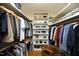 A well-organized walk-in closet with shelving and hanging racks at 817 Old Mill Rd, Chapel Hill, NC 27514