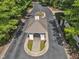 Aerial view of the community entrance featuring well-manicured landscaping and mature trees at 85 Christenbury Ln, Clayton, NC 27527