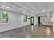 Spacious basement featuring bright lighting, concrete flooring, and multiple windows at 85 Christenbury Ln, Clayton, NC 27527