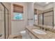 Bathroom featuring granite countertops, tile flooring, and a glass-enclosed shower at 85 Christenbury Ln, Clayton, NC 27527
