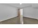Clean bedroom with concrete floors and view into closet at 85 Christenbury Ln, Clayton, NC 27527