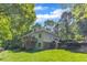 Back exterior view of home with large backyard, deck, porch, steps, and well-maintained lawn at 85 Christenbury Ln, Clayton, NC 27527