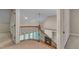 Foyer featuring a wooden staircase, wrought iron railing, and views into the living room at 85 Christenbury Ln, Clayton, NC 27527