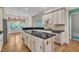 Open kitchen with large island, stainless steel appliances, and eat-in area with backyard views at 85 Christenbury Ln, Clayton, NC 27527