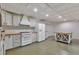 Basement kitchen featuring painted cabinets, butcher block countertops, and stainless steel appliances at 85 Christenbury Ln, Clayton, NC 27527