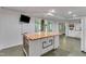 Kitchen island featuring a wood top, a white base, and an open floor plan at 85 Christenbury Ln, Clayton, NC 27527