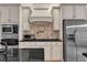 Well-equipped kitchen features stainless steel appliances, custom cabinetry, and granite countertops at 85 Christenbury Ln, Clayton, NC 27527