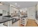 Spacious kitchen boasts an island, stainless appliances, granite countertops, and custom cabinetry at 85 Christenbury Ln, Clayton, NC 27527
