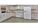 Bright kitchen featuring painted cabinets, butcher block countertops, and modern appliances at 85 Christenbury Ln, Clayton, NC 27527