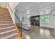 Open living room featuring a staircase, fireplace, and modern finishes at 85 Christenbury Ln, Clayton, NC 27527