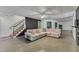 Spacious living room featuring a decorative ceiling, concrete floors, and comfortable furniture at 85 Christenbury Ln, Clayton, NC 27527