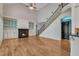 Bright and open living room with fireplace, custom built-ins, and staircase at 85 Christenbury Ln, Clayton, NC 27527