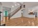 Spacious living room with fireplace, staircase, and access to the kitchen at 85 Christenbury Ln, Clayton, NC 27527