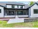 Exterior view of the home, showing the screen porch, patio, and landscaped backyard at 92 Bluffside Ct, Pittsboro, NC 27312