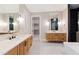 Spacious bathroom featuring double vanities, walk-in closet, and modern fixtures with sleek design at 92 Bluffside Ct, Pittsboro, NC 27312