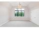 Spacious bedroom featuring high ceilings, neutral carpet and a large window at 92 Bluffside Ct, Pittsboro, NC 27312