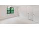 Bright bedroom with neutral carpet, a large window and white doors at 92 Bluffside Ct, Pittsboro, NC 27312
