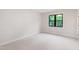 Bright bedroom with neutral carpet, a large window and freshly painted walls at 92 Bluffside Ct, Pittsboro, NC 27312