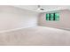 Bright spacious bedroom featuring neutral carpet, recessed lighting and scenic window view at 92 Bluffside Ct, Pittsboro, NC 27312