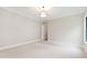 Bright bedroom with large windows, crown molding, and neutral color scheme provides a calm and inviting space at 92 Bluffside Ct, Pittsboro, NC 27312