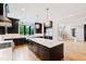 Gourmet kitchen with dark cabinetry, quartz countertops, and stainless steel appliances at 92 Bluffside Ct, Pittsboro, NC 27312