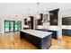 Spacious kitchen featuring a large island, modern appliances, and stylish lighting at 92 Bluffside Ct, Pittsboro, NC 27312