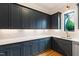 Stylish kitchen showcasing custom cabinetry, white countertops, and modern fixtures at 92 Bluffside Ct, Pittsboro, NC 27312