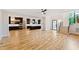 Open concept living space with hardwood floors and staircase leading to the second floor at 92 Bluffside Ct, Pittsboro, NC 27312