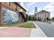Street view of building with a large mural on the exterior wall, and the Courthouse in the background at 92 Bluffside Ct, Pittsboro, NC 27312