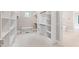 Bright walk-in closet with custom shelving and ample storage space for organization and wardrobe display at 92 Bluffside Ct, Pittsboro, NC 27312