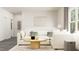Comfortable living room with stylish sectional sofa, modern decor, and plenty of natural light at 304 Calvander Ln, Apex, NC 27539