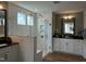 Elegant bathroom with glass shower, white cabinets, and modern fixtures and countertops at 0001 Luke Lane, Cedar Grove, NC 27231
