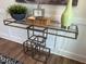 Stylish console table featuring a glass top and unique geometric design in a modern setting at 0001 Luke Lane, Cedar Grove, NC 27231