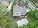 Aerial view of home with screened porch, basketball court, and beautiful landscaping at 101 Goldenthal Ct, Cary, NC 27519