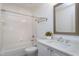 Bright bathroom features a bathtub with a shower and a single sink vanity at 101 Goldenthal Ct, Cary, NC 27519