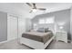 This cozy bedroom has plush carpet, ceiling fan, and natural light from the windows at 101 Goldenthal Ct, Cary, NC 27519