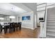 Elegant dining room with hardwood floors, stylish decor, and a staircase leading to the upper level at 101 Goldenthal Ct, Cary, NC 27519