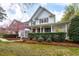 Charming two-story home with a large front porch and well-manicured landscaping at 101 Goldenthal Ct, Cary, NC 27519