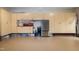 Spacious garage with ample storage cabinets, refrigerator and epoxy floor at 101 Goldenthal Ct, Cary, NC 27519