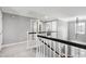 Elegant hallway with white banisters and an open view of the entryway below at 101 Goldenthal Ct, Cary, NC 27519