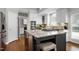 Eat-in kitchen boasts a central island, granite countertops, and stainless steel appliances at 101 Goldenthal Ct, Cary, NC 27519