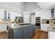 Kitchen features stainless appliances, center island with gas cooktop and a breakfast bar at 101 Goldenthal Ct, Cary, NC 27519