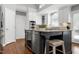 This kitchen has a wine fridge, stainless appliances, breakfast bar, and granite countertops at 101 Goldenthal Ct, Cary, NC 27519