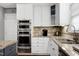 Kitchen features stainless steel appliances, granite countertops and a built-in oven/microwave combo at 101 Goldenthal Ct, Cary, NC 27519