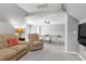 This lounge area is open to the game room, offering recessed lights and neutral colors at 101 Goldenthal Ct, Cary, NC 27519