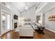 Spacious living room with fireplace, tall ceilings, hardwood floors, and comfortable seating at 101 Goldenthal Ct, Cary, NC 27519