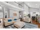 Bright and airy living room with hardwood floors, cathedral ceiling and seamless flow into the kitchen at 101 Goldenthal Ct, Cary, NC 27519