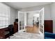 Home office with hardwood floors, lots of natural light, custom built-ins, and glass french doors at 101 Goldenthal Ct, Cary, NC 27519